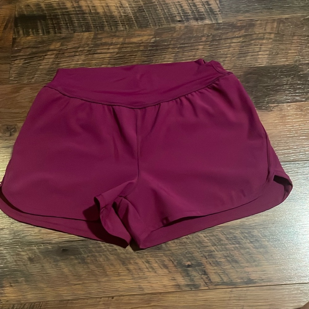 Magenta girls athletic shorts, size large , with under lining
